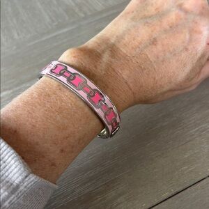 Halcyon Days Chain enamel hinged bangle in a pink and gold colorway.